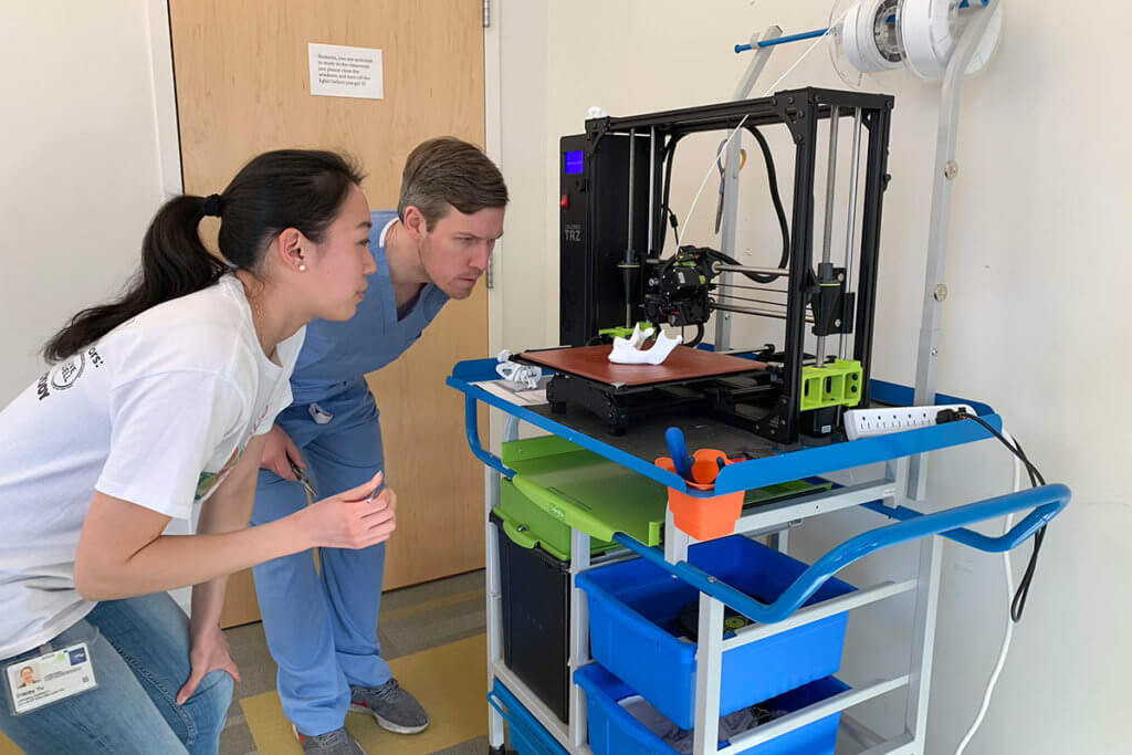 Faculty and staff using 3D printing mobile cart