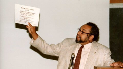 bradley holding black caucus sign