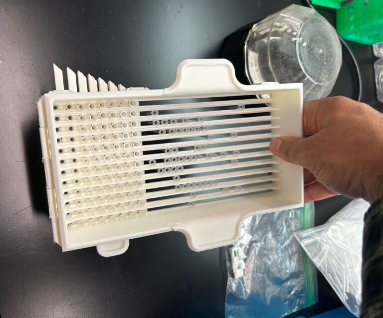 Hand holding a 3D printed pipette sorter