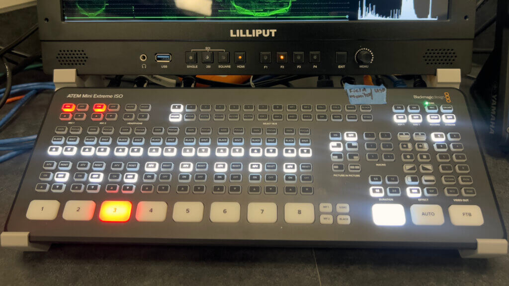 Control board and field monitor on stand in UCSF digital media suite.