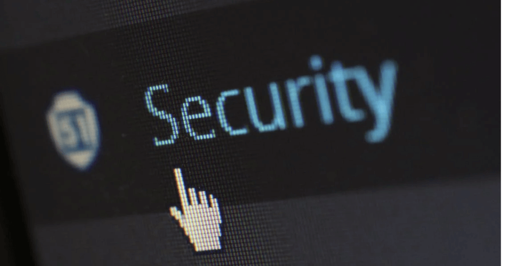 Computer screen with pointing finger cursor below the word "security"